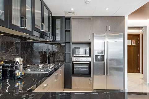 Chic Kitchen: Cook up a storm in style with sleek appliances and stunning marble accents!