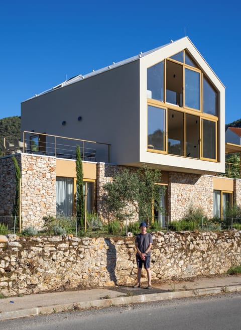 The huge windows on the front of the house look out to beautiful scenery