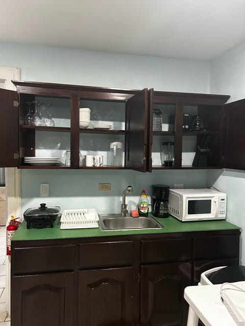 Microwave, cookware/dishes/utensils, dining tables