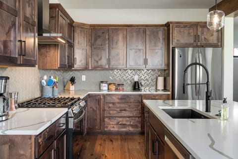 Fully-stocked kitchen with dishwasher, microwave, coffee maker, blender, etc.