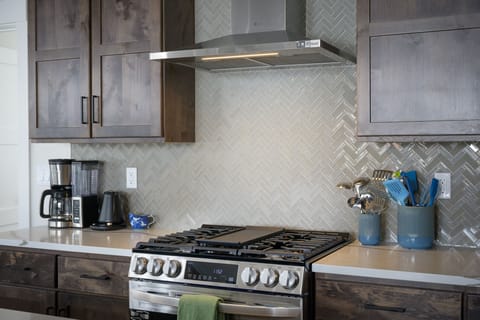 Gas range with griddle and true ventilation to the outside.