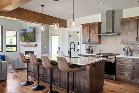 The kitchen island seats 4 with adjustable height swivel stools.