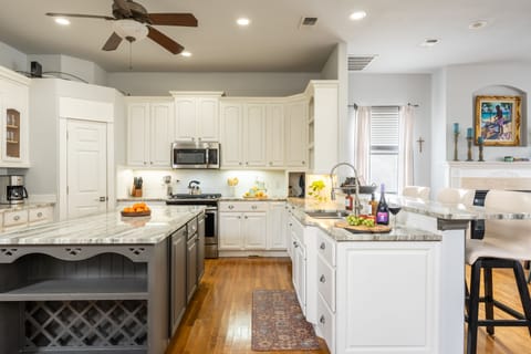 An island and barstool seating in the kitchen.