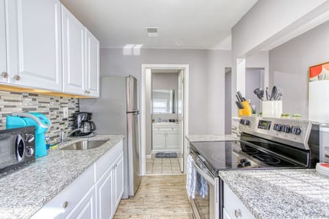 You’ll love the convenience of this fully equipped kitchen, where you can brew coffee, cook meals, or prepare snacks. The cozy layout and warm ambiance make cooking here a delightful part of your stay.