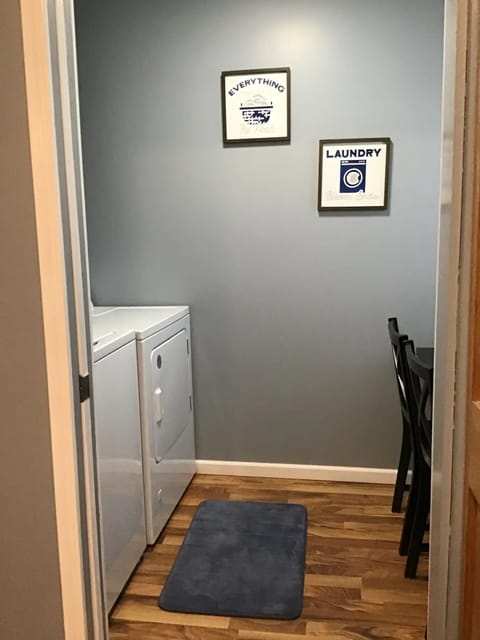Laundry room with iron and folding table