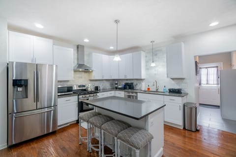 A fully updated kitchen with stainless steel appliances. 