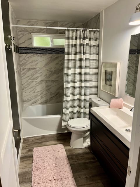 Combined shower/tub, hair dryer, towels, soap