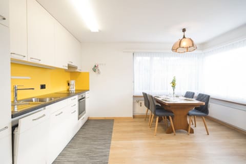 Modern kitchen with dining table