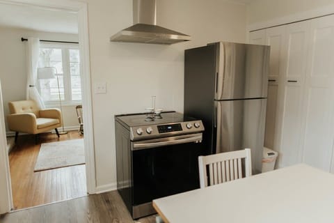 Complete your kitchen experience with a modern refrigerator and sleek range, adding both functionality and style to your culinary haven.