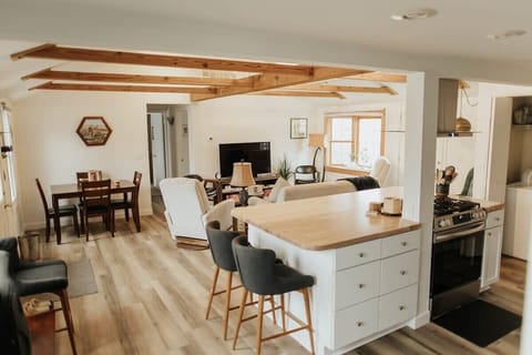 Behold our elegant kitchen cabinets, meticulously crafted to exude sophistication and style. Adorned with sleek appliances including a microwave and coffee maker, along with a selection of sharp knives and other essential kitchen items, our kitchen is a haven for culinary enthusiasts. Whether you're brewing your morning coffee or preparing a gourmet feast, our kitchen provides the perfect back...