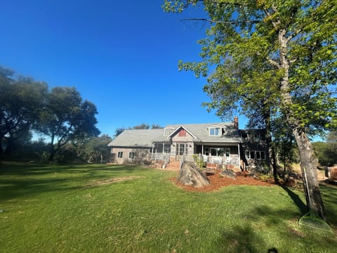 Bonanza Barn Retreat Front of House-porch, croquet field and view of 10 acres