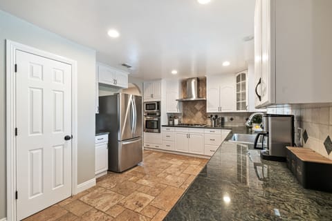 Gourmet chef's kitchen, complete with top-of-the-line appliances.