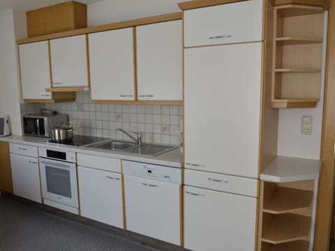 Cabinetry, Kitchen Sink, Sink, Countertop, Tap, Furniture, Building, Kitchen Stove, Kitchen, Wood