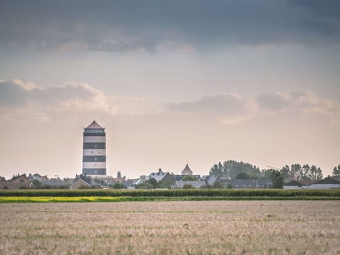 Cloud, Sky, Plant, Atmosphere, Daytime, Building, Natural Landscape, Tree, Tower, Land Lot