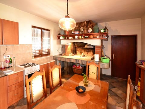 Furniture, Countertop, Table, Kitchen Appliance, Wood, Home Appliance, Kitchen, Orange, Kitchen Stove, Lighting