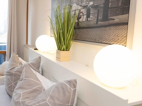 Furniture, Interior Design, Wall, Lighting, Home, Room, Light Fixture, Flooring, Textile, Ceiling