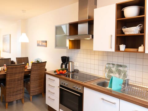 Furniture, Countertop, Interior Design, Kitchen, Kitchen Appliance, Flooring, Cabinetry, Wood, Major Appliance, Floor