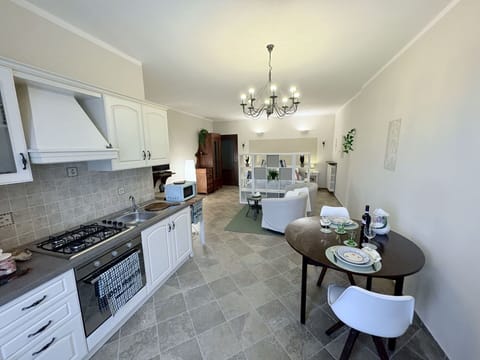 Furniture, Interior Design, Flooring, Floor, Countertop, Kitchen, Ceiling, Cabinetry, Room, Kitchen & Dining Room Table