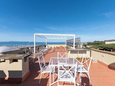 Sky, Property, Building, Shade, Wood, Water, Urban Design, Tree, Roof, Facade