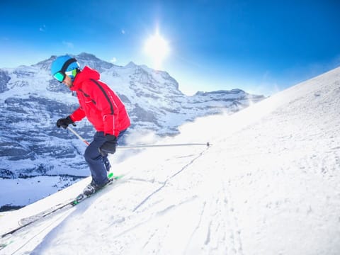 Sky, Snow, Mountain, Sports Equipment, Slope, Cloud, Outdoor Recreation, Terrain