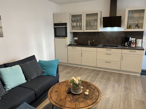 Cabinetry, Property, Furniture, Countertop, Tap, Sink, Couch, Interior Design, Wood, Floor