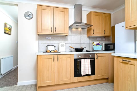 Kitchen with oven and hob, fridge freezer