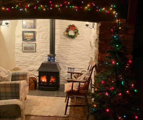 Inglenook fireplace with Christmas fairy lights