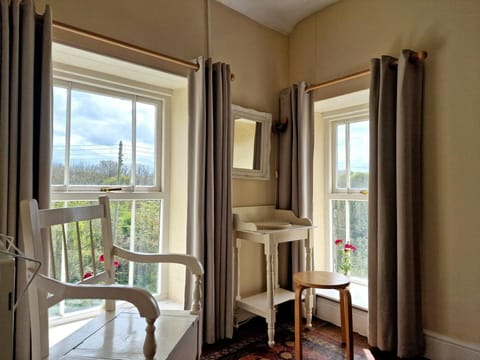 Double bedroom with views over the garden from two windows