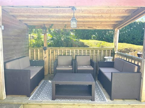 outdoor furniture under pergola in garden