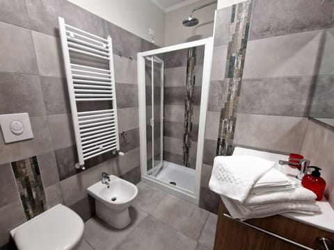 Shower, eco-friendly toiletries, hair dryer, bidet