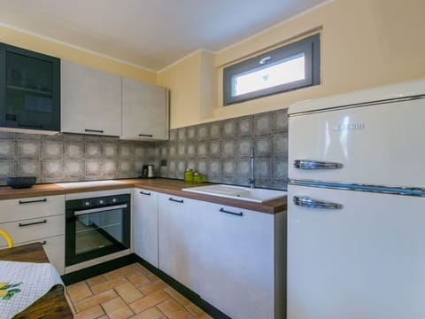 Cabinetry, Countertop, Building, Kitchen Appliance, Kitchen Stove, Kitchen, Flooring, Home Appliance, Tap, Floor