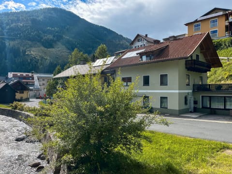 Plant, Sky, Cloud, Property, Building, Mountain, Window, Nature, Natural Landscape, Tree