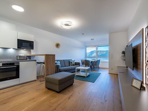 Table, Furniture, Couch, Lighting, Television, Building, Flooring, Chair, Interior Design, Floor