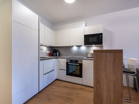 Cabinetry, Countertop, Building, Furniture, Kitchen Appliance, Kitchen, Kitchen Stove, Home Appliance, Wood, Interior Design