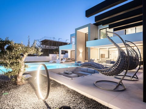 Sky, Plant, Shade, Outdoor Furniture, Swimming Pool, Urban Design, Leisure, Real Estate, Facade, Sunlounger