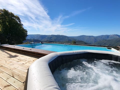 Blue, Swimming Pool, Mountain Range, Ridge, Resort, Deck, Hardwood, Outdoor Furniture, Eco Hotel, Alps
