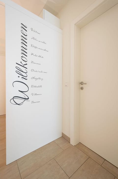 Wood, Art, Flooring, Floor, Wall, Font, Hardwood, Door