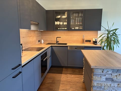 Furniture, Countertop, Cabinetry, Kitchen, Flooring, Interior Design, Wood, Kitchen Appliance, Floor, Drawer