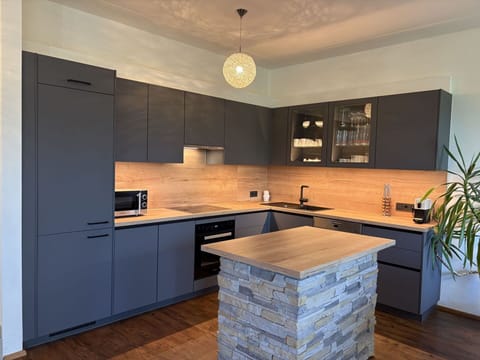 Furniture, Cabinetry, Countertop, Interior Design, Flooring, Kitchen, Wood, Drawer, Floor, Kitchen Appliance