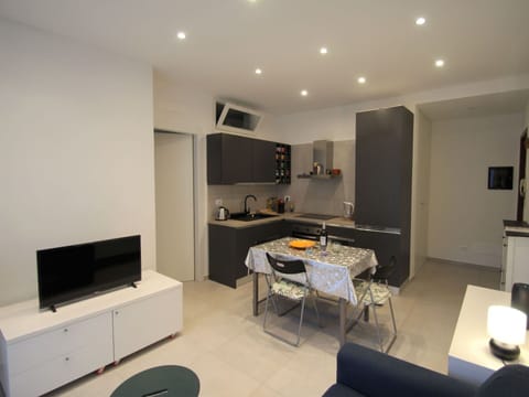 Furniture, Table, Couch, Interior Design, Building, Comfort, Home Appliance, Television, Floor, Flooring