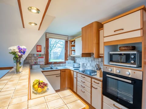 Kitchen, Countertop, Kitchen Appliance, Interior Design, Flooring, Wood, Cabinetry, Major Appliance, Furniture, Floor