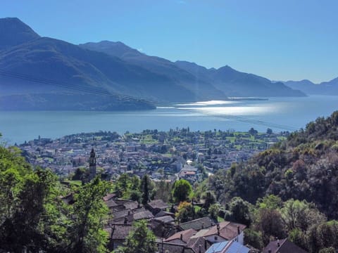 Water, Sky, Mountain, Nature, Building, Azure, Natural Landscape, Tree, Vegetation, Highland