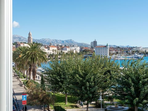 Table, Sky, Furniture, Property, Plant, Chair, Outdoor Table, Outdoor Furniture, Tableware, Building