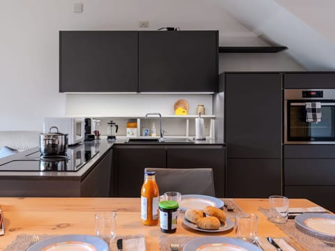 Food, Table, Countertop, Property, Tableware, Cabinetry, Dishware, Interior Design, Orange, Kitchen