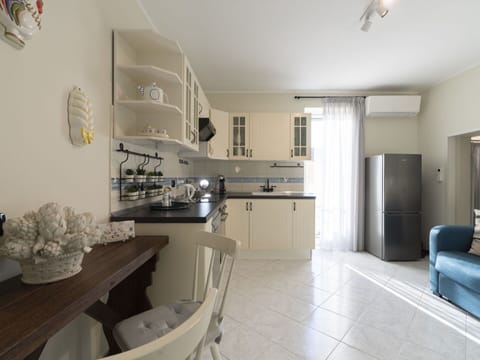 Countertop, Cabinetry, Interior Design, Building, Lighting, Kitchen, House, Living Room, Flooring