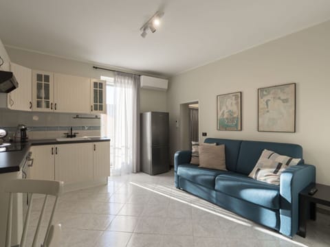 Property, Furniture, Picture Frame, Cabinetry, Couch, Countertop, Lighting, Wood, Interior Design, Kitchen Appliance