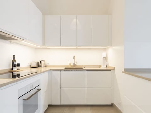 Cabinetry, Countertop, Tap, Furniture, Property, Sink, Kitchen, Interior Design, Wood, Flooring