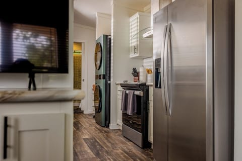 Stackable Front Loading W/D, Electric Range, Large Fridge / Freezer