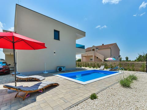 Sky, Property, Building, Plant, Cloud, Shade, Swimming Pool, Outdoor Furniture, House, Window