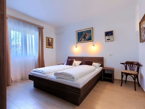 Sky, Building, Table, Window, Outdoor Furniture, Urban Design, Wood, Shade, Condominium, House